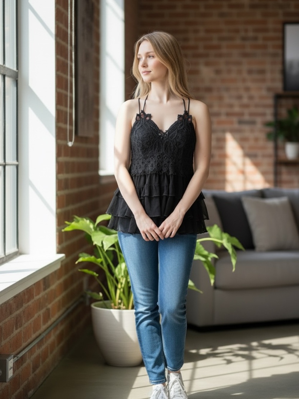 2Bella Cami in black featuring a crochet lace bodice and tiered ruffled hem.